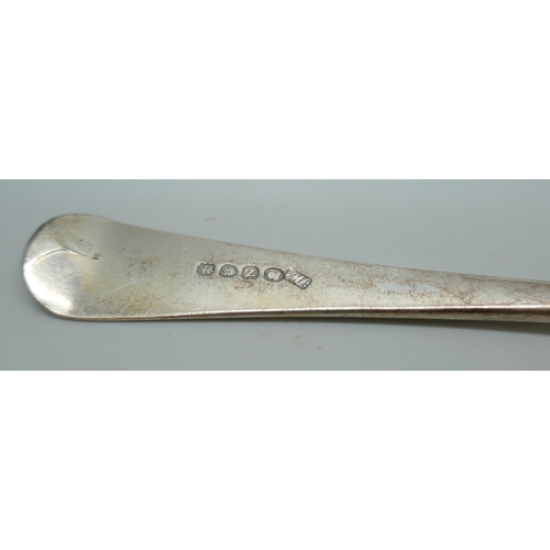 7242 - A George III silver serving spoon, London 1808, and a pair of Georgian silver sugar bows with monogr... 