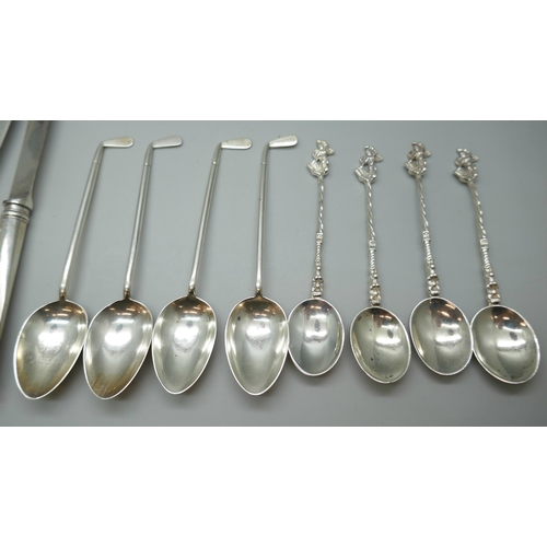 7246 - Two sets of silver spoons including four Walker & Hall golf spoons, 127g, and a set of silver handle... 