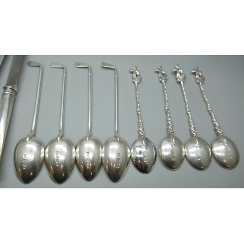 7246 - Two sets of silver spoons including four Walker & Hall golf spoons, 127g, and a set of silver handle... 