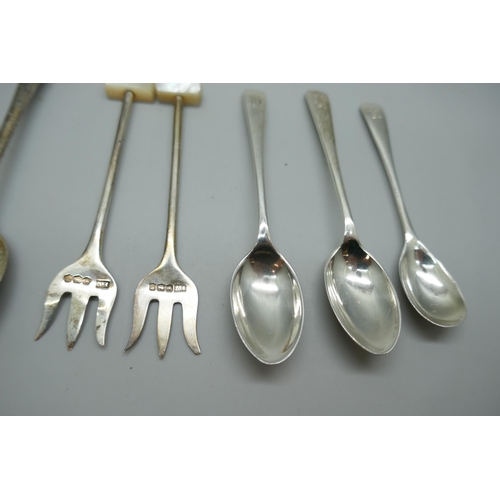 7247 - A collection of silver spoons and olive forks, 79g