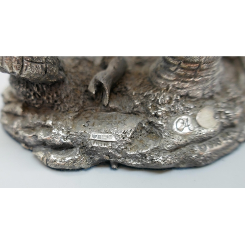 7251 - A hallmarked silver 'filled' model of an elephant, faux ivory tusks, 18.5cm tall