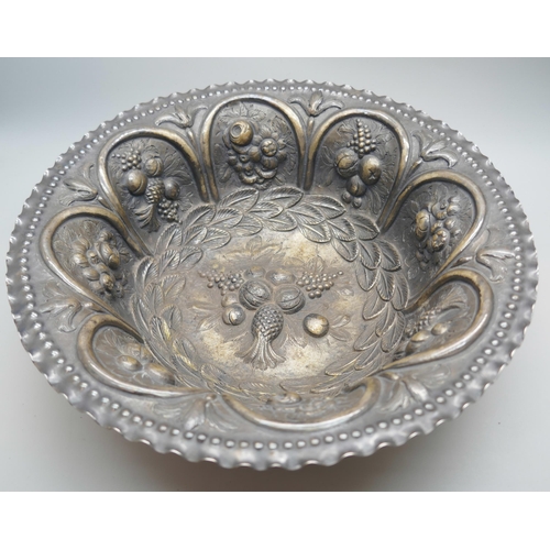 7252 - A Victorian silver bowl with embossed fruit and foliage design depicting pineapples and grapes, Lond... 