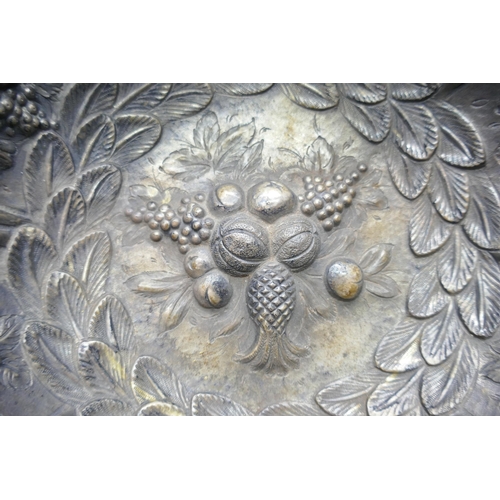 7252 - A Victorian silver bowl with embossed fruit and foliage design depicting pineapples and grapes, Lond... 