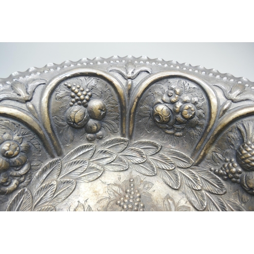 7252 - A Victorian silver bowl with embossed fruit and foliage design depicting pineapples and grapes, Lond... 