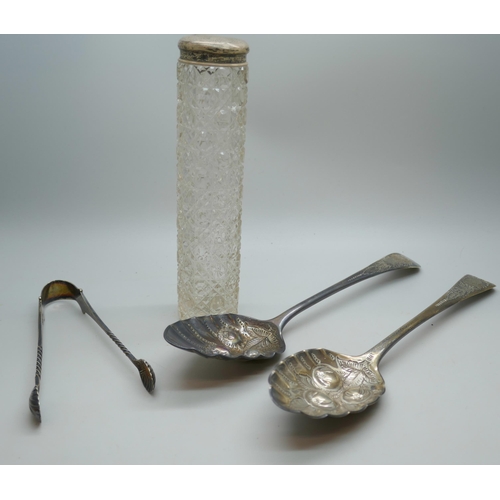 7256 - Two Georgian silver berry spoons, a pair of silver sugar bows, and a silver topped hat pin jar, 149g