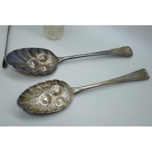 7256 - Two Georgian silver berry spoons, a pair of silver sugar bows, and a silver topped hat pin jar, 149g