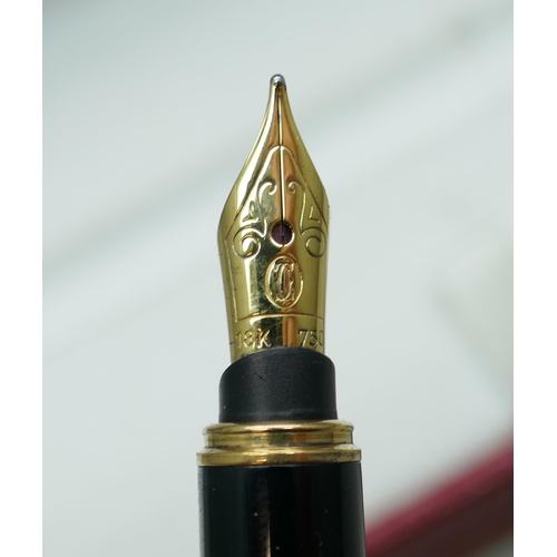 7267 - A Cartier gold plated fountain pen with 18k gold nib, serial number 024374, boxed with 2 leaflets