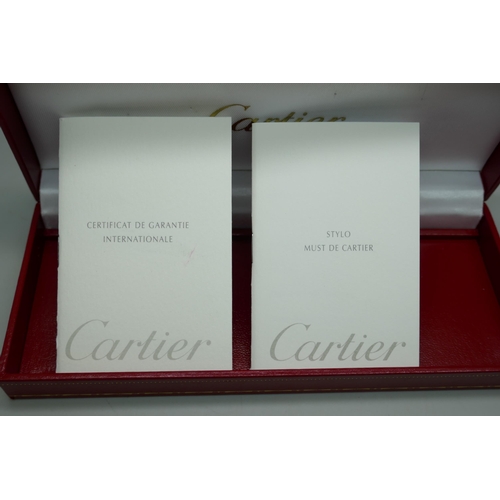 7267 - A Cartier gold plated fountain pen with 18k gold nib, serial number 024374, boxed with 2 leaflets