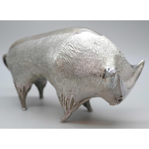 7270 - A silver stylised model of a bull, set with garnet eyes, London 1962, 322g