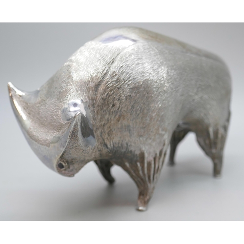 7270 - A silver stylised model of a bull, set with garnet eyes, London 1962, 322g