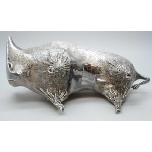 7270 - A silver stylised model of a bull, set with garnet eyes, London 1962, 322g