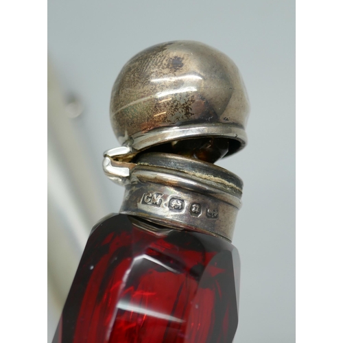 7271 - A silver cheroot case, 19g, and a silver topped glass scent bottle