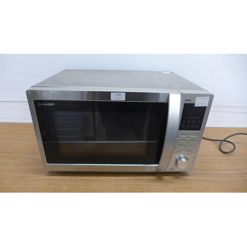 5106 - A Sharpe 900w microwave oven with spare microwave plate