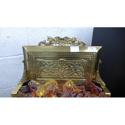 5113 - An Imperial Electric Co. Ltd. brass fire surround electric heater with coloured glass coals