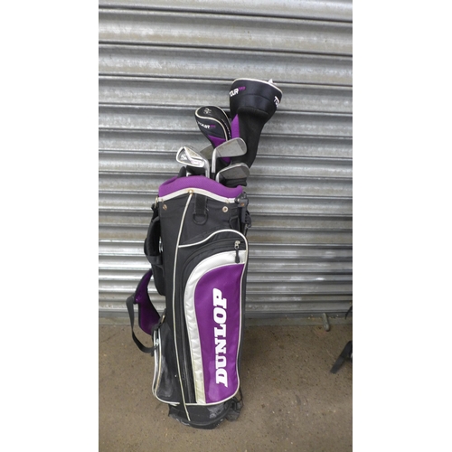 5139 - Two Dunlop golf bags containing assorted Dunlop clubs including drivers, irons and putters and Ben S... 