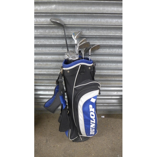 5139 - Two Dunlop golf bags containing assorted Dunlop clubs including drivers, irons and putters and Ben S... 