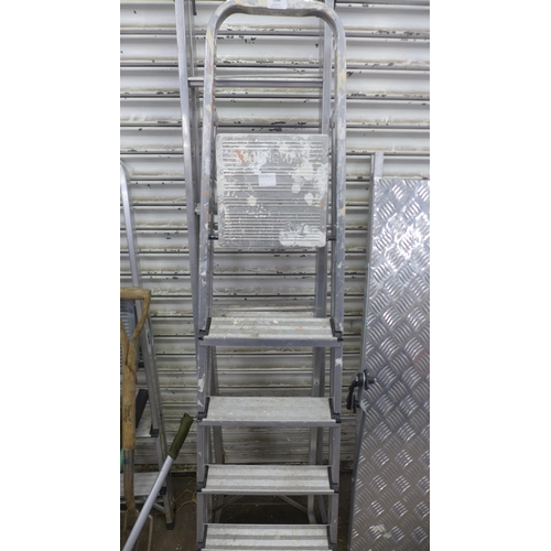 5148 - A set of six rung aluminium step-ladders and a set of five rung aluminium step-ladders