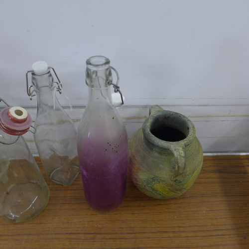 5151 - A collection of vintage glass bottles and a pot jug in a wooden storage crate