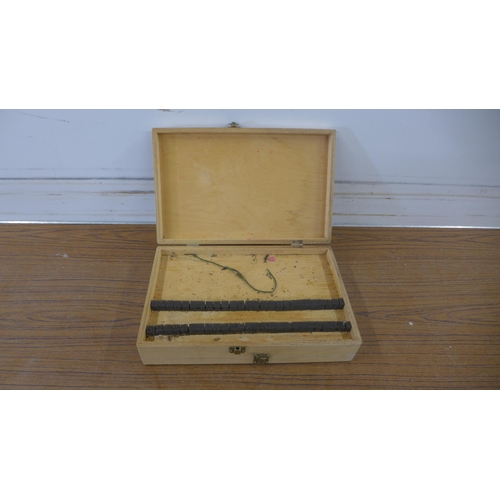 5159 - A wooden fishing float case with a quantity of fishing rods