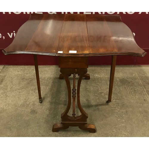 180 - An Edward VII mahogany Sutherland table