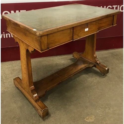 183 - A Victorian walnut and green leather topped double sided library table