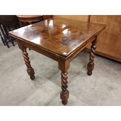 177 - An early 20th Century oak barleytwist draw leaf table