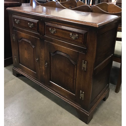 185 - A George III style oak dresser