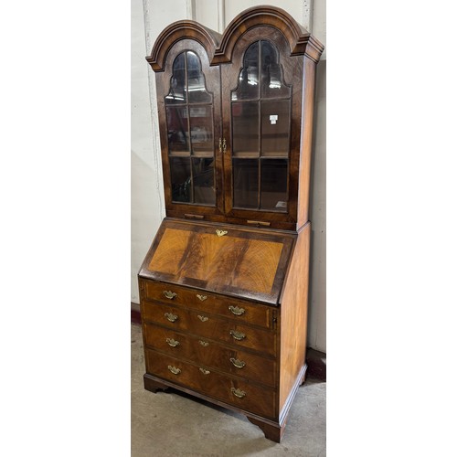 215 - A Queen Anne style walnut dome topped bureau bookcase