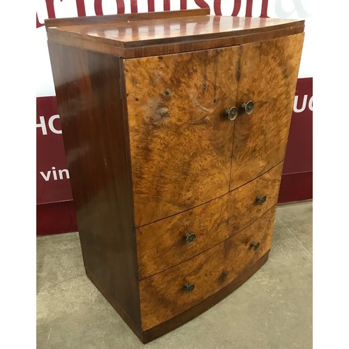 192 - An Art Deco burr walnut bowfront tallboy