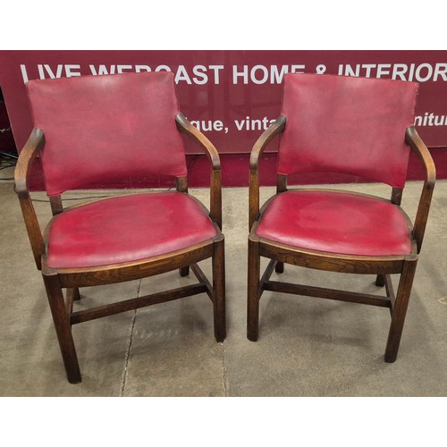 186A - A pair of Art Deco Waring & Gillow oak and red vinyl desk chairs