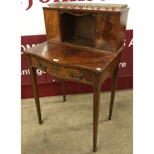 196 - A Regency style mahogany serpentine bonheur de jour