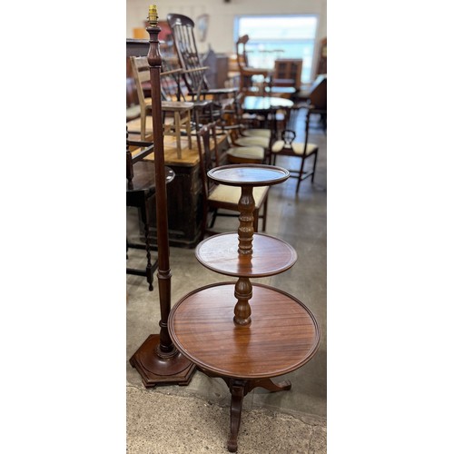 223 - A Victorian style mahogany three tier dumb waiter and a standard lamp