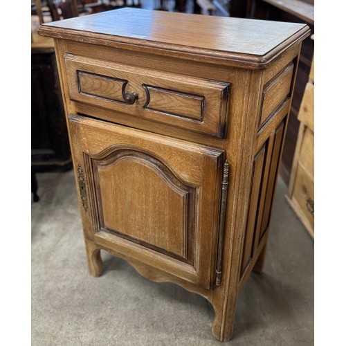 226 - A 19th Century style French oak single door cupboard