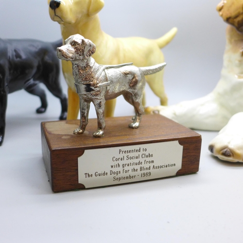 2025 - Two Beswick model labradors, black and golden, a large Goebel model of a puppy and a Guide Dogs for ... 