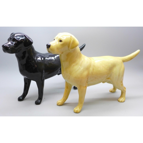 2025 - Two Beswick model labradors, black and golden, a large Goebel model of a puppy and a Guide Dogs for ... 