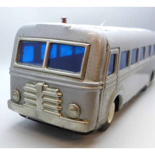 2034 - A tin-plate battery operated toy model bus, Masudaya, 35cm