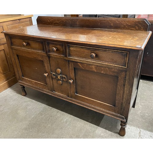 256 - An early 20th Century oak sideboard