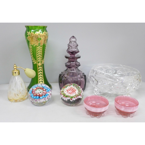 2072 - A pair of cranberry glass salts, a green glass vase, a purple glass decanter, two millefiori paperwe... 