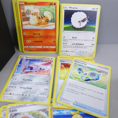 2092 - A large collection of Pokémon cards, over 600 including Holographic, also with a collectors tin