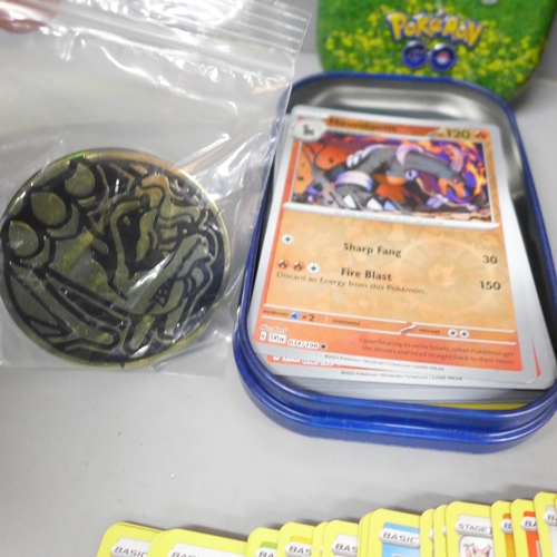 2092 - A large collection of Pokémon cards, over 600 including Holographic, also with a collectors tin