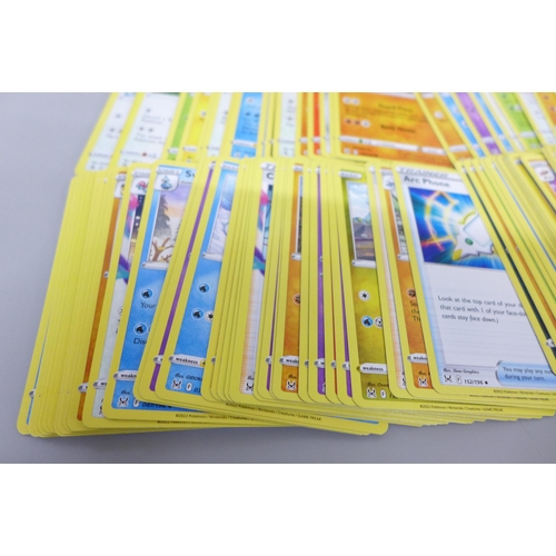 2092 - A large collection of Pokémon cards, over 600 including Holographic, also with a collectors tin