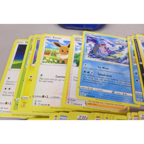 2092 - A large collection of Pokémon cards, over 600 including Holographic, also with a collectors tin