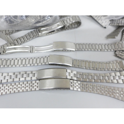 2099 - A large collection of stainless steel watch bracelets, (all as new unused)