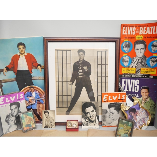 2102 - A collection of Elvis memorabilia and collectables, includes clip-on earrings, 78 rpm singles, frame... 