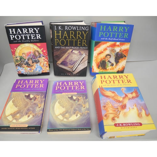 2124 - Four Harry Potter first edition books, plus seven other J K Rowling books and a folder of Harry Pott... 