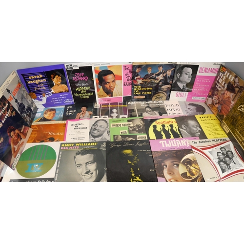 2136 - A collection of twenty-eight late 1950s/60s vinyl records, all in picture sleeves. To include Elvis,... 