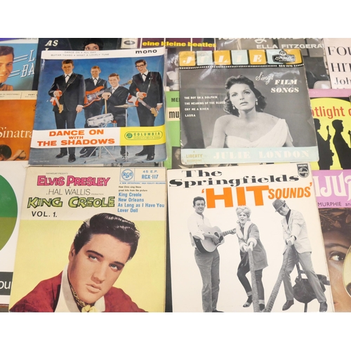 2136 - A collection of twenty-eight late 1950s/60s vinyl records, all in picture sleeves. To include Elvis,... 