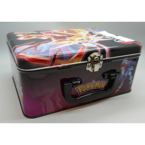 2182 - A Pokémon collectors tin chest with quantity of Holographic cards and mini binder, etc.