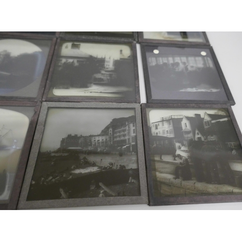 2204 - A box of 44 Victorian and Edwardian lantern slides, includes beach scenes, street scenes, motor car ... 