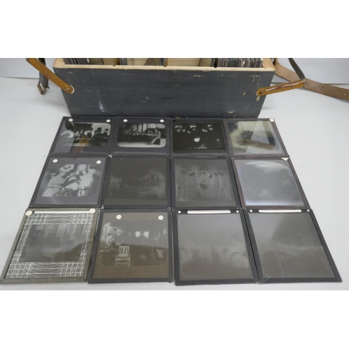 2204 - A box of 44 Victorian and Edwardian lantern slides, includes beach scenes, street scenes, motor car ... 